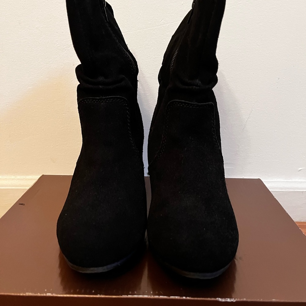 Black suede wedge bootie.